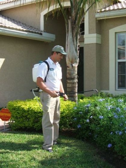 Precision Pest Control technician applying a targeted treatment